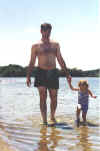 Claire and Daddy returning from the water, 6/99
